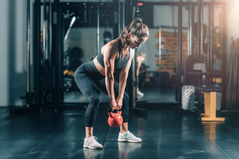mujer durante el entrenamiento de FBW